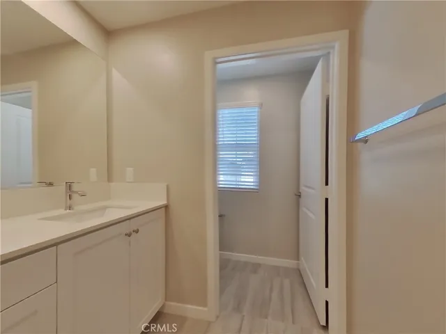 a en suite bathroom with a sink and mirror