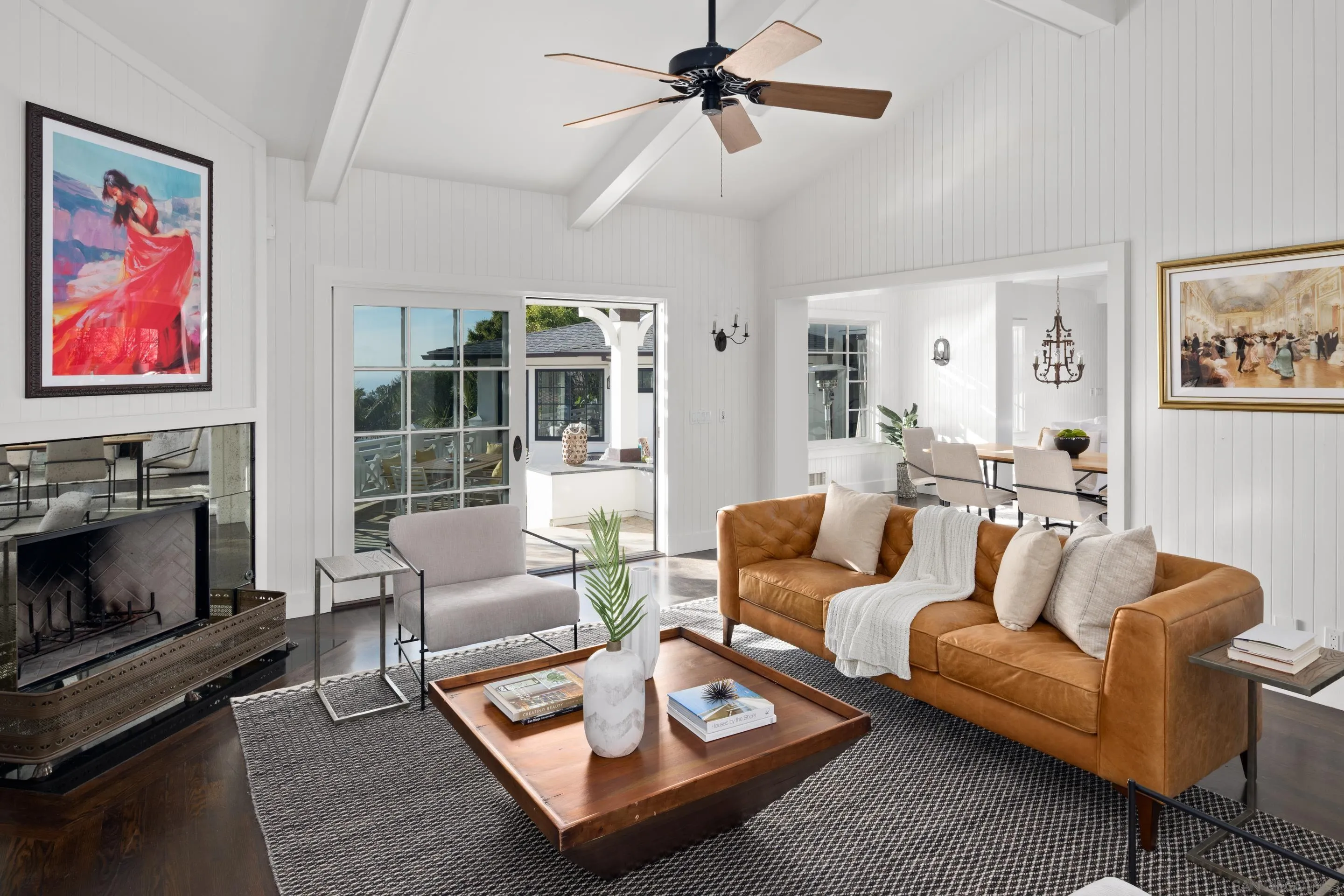 935 Havenhurst Drive La Jolla, CA 92037 - Photo 15 of 21 a living room with furniture a flat screen tv and a fireplace