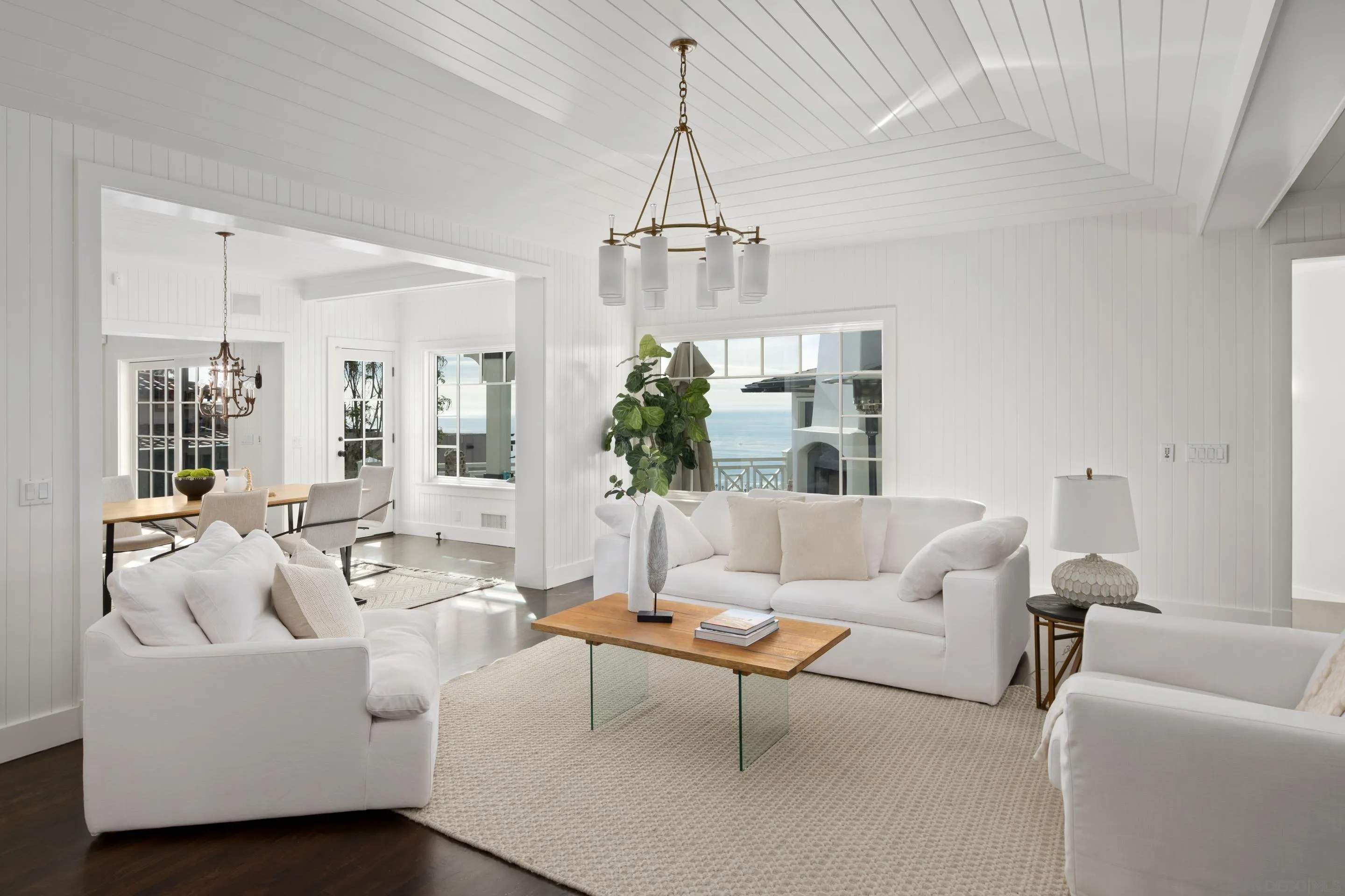 935 Havenhurst Drive La Jolla, CA 92037 - Photo 17 of 21 a living room with furniture a chandelier and a chandelier