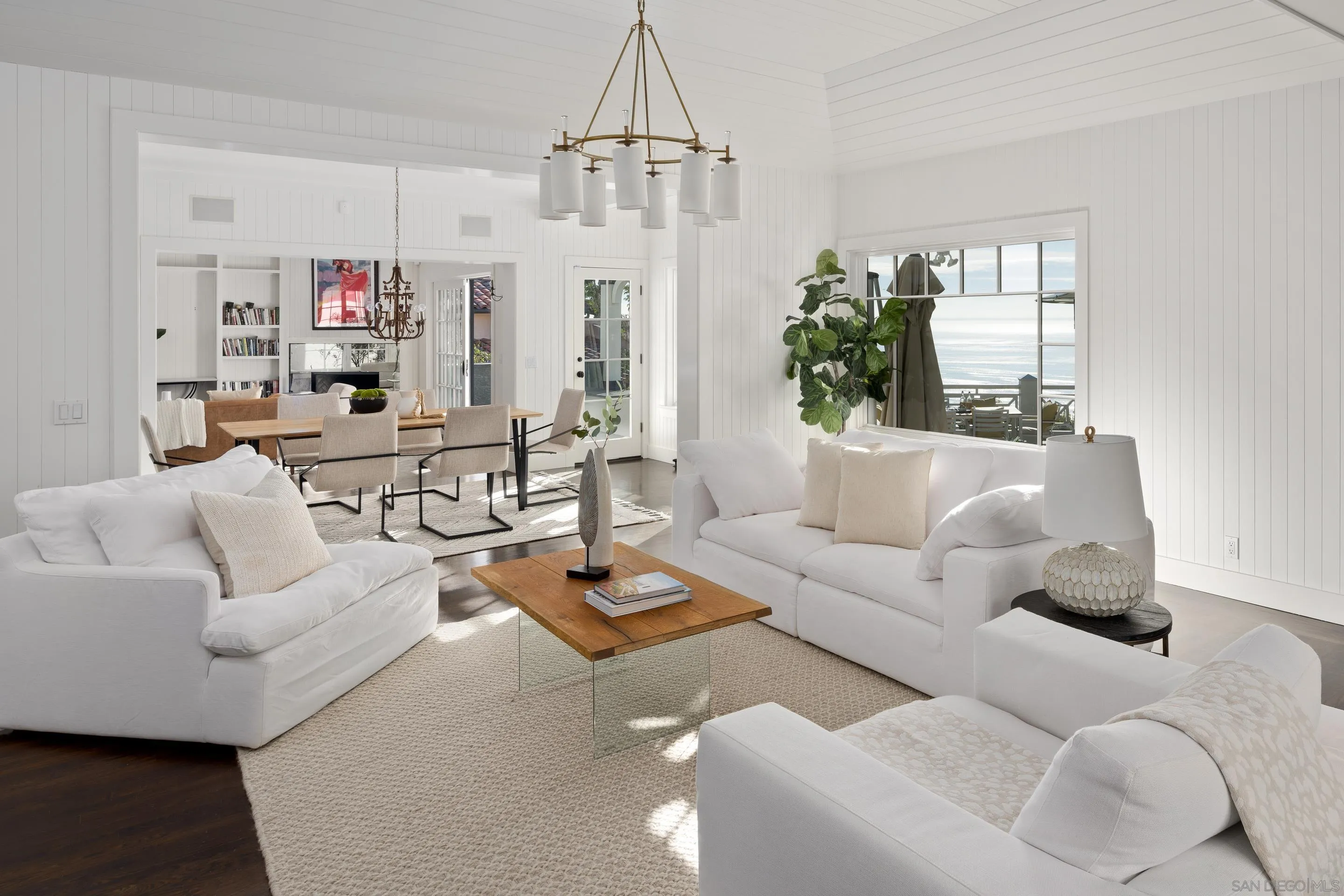 935 Havenhurst Drive La Jolla, CA 92037 - Photo 18 of 21 a living room with furniture and a chandelier