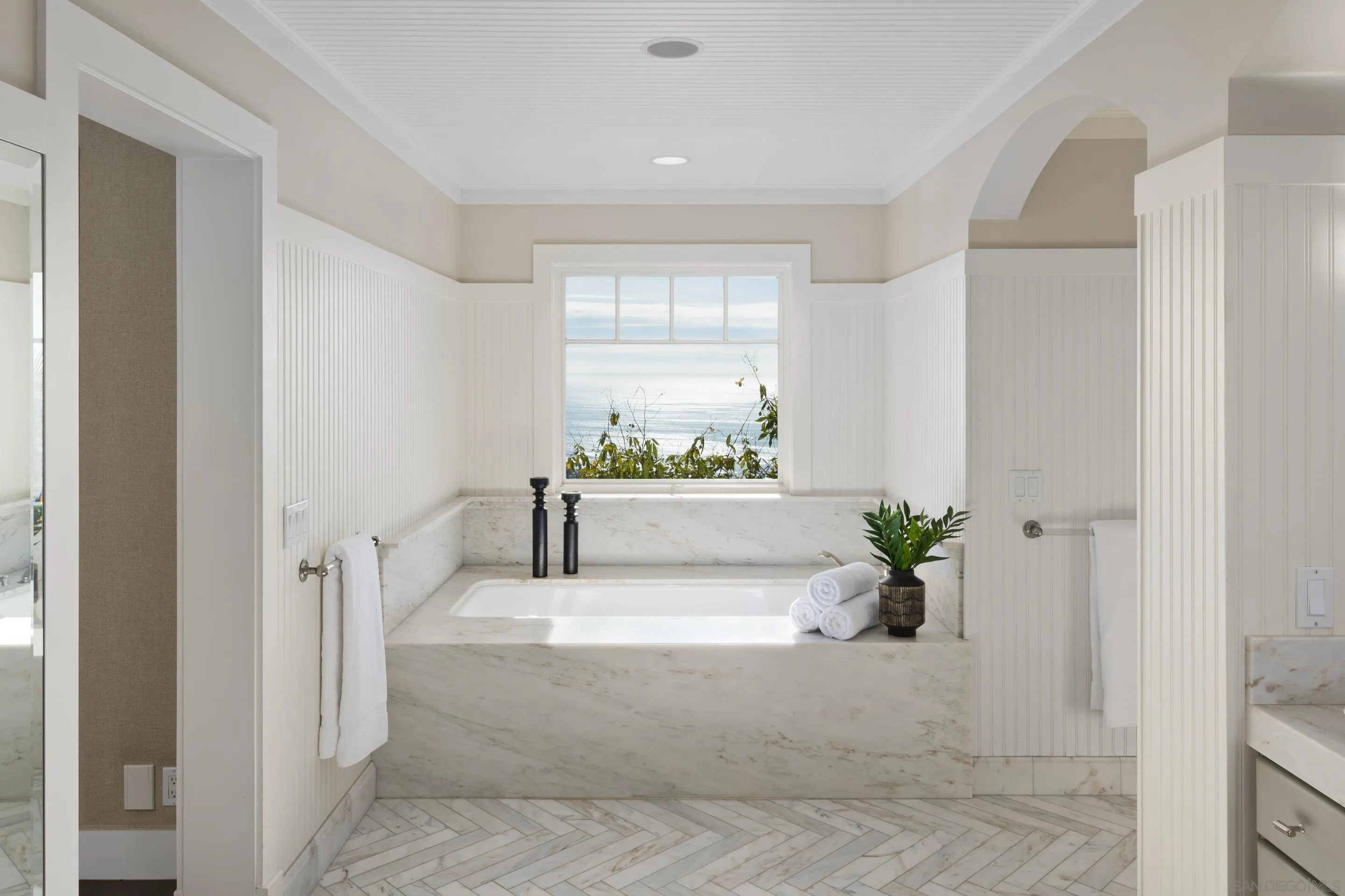 935 Havenhurst Drive La Jolla, CA 92037 - Photo 20 of 21 a white tub sitting in a spacious bathroom next to a window