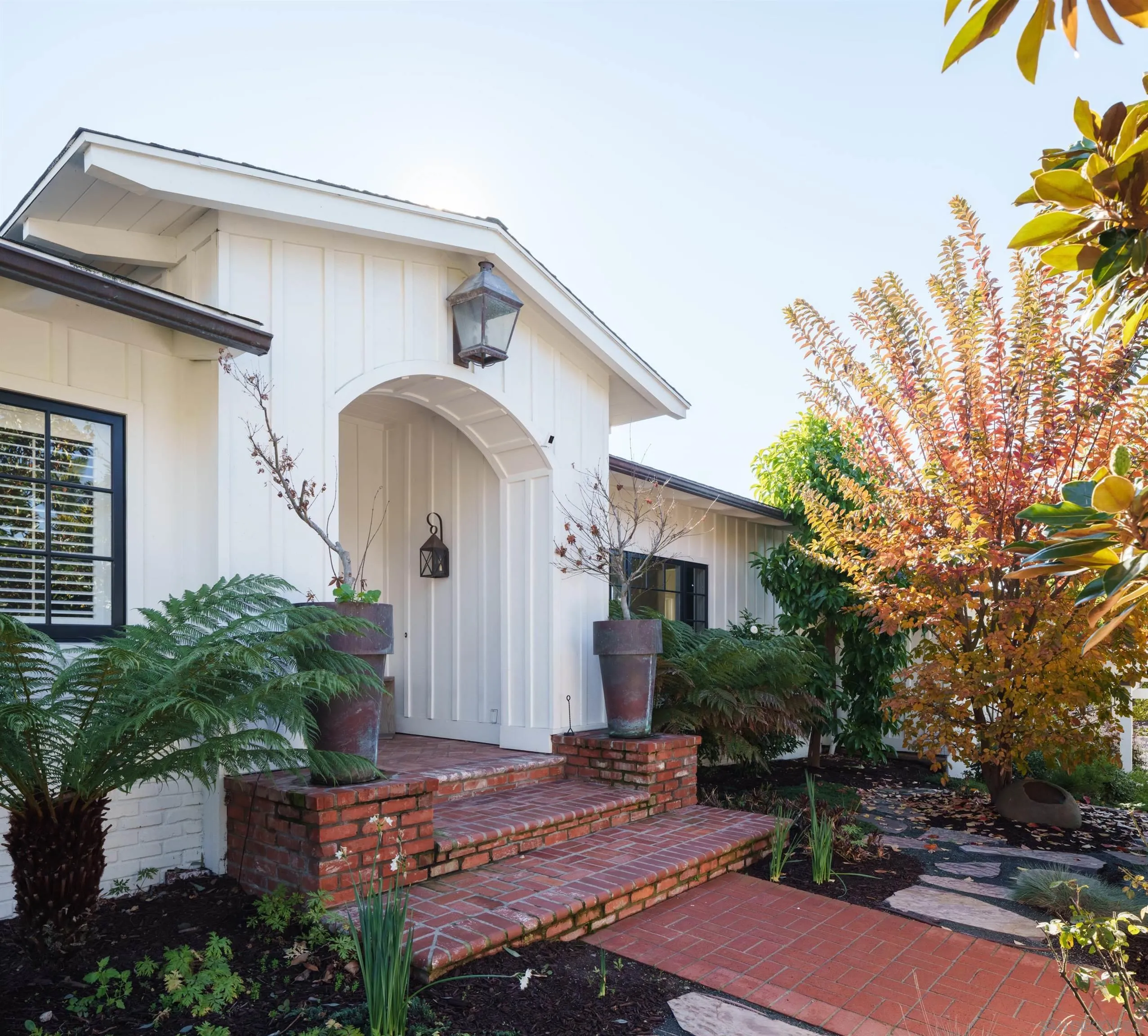 935 Havenhurst Drive La Jolla, CA 92037 - Photo 2 of 21 a front view of a house with garden