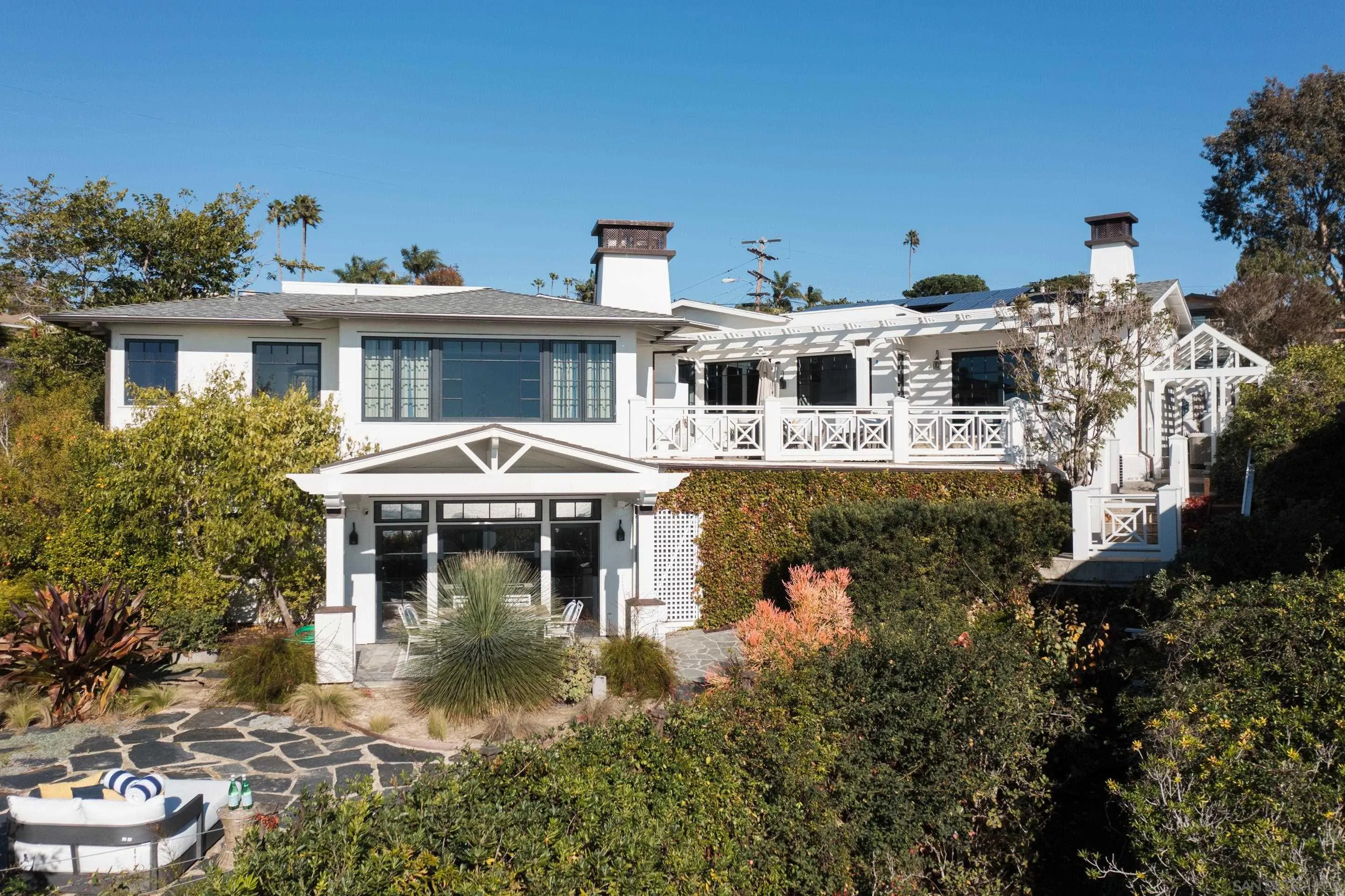 935 Havenhurst Drive La Jolla, CA 92037 - Photo 4 of 21 a front view of a house with yard and lake view