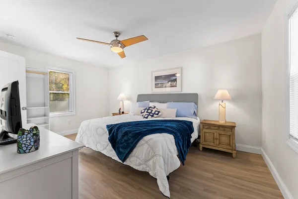 a bedroom with a bed and a bathroom