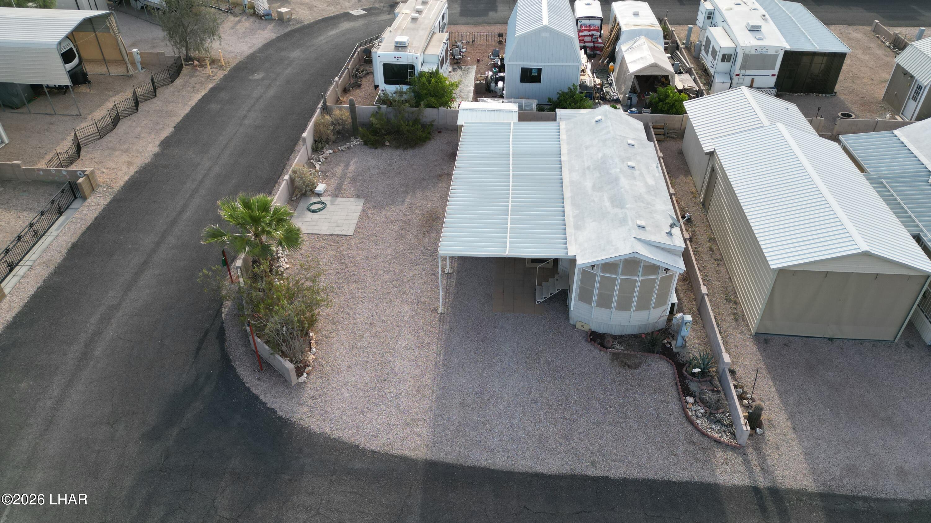 41 North Sagebrush Road Quartzsite, AZ 85346 - Photo 3 of 33 an aerial view of a house with a garden and parking space