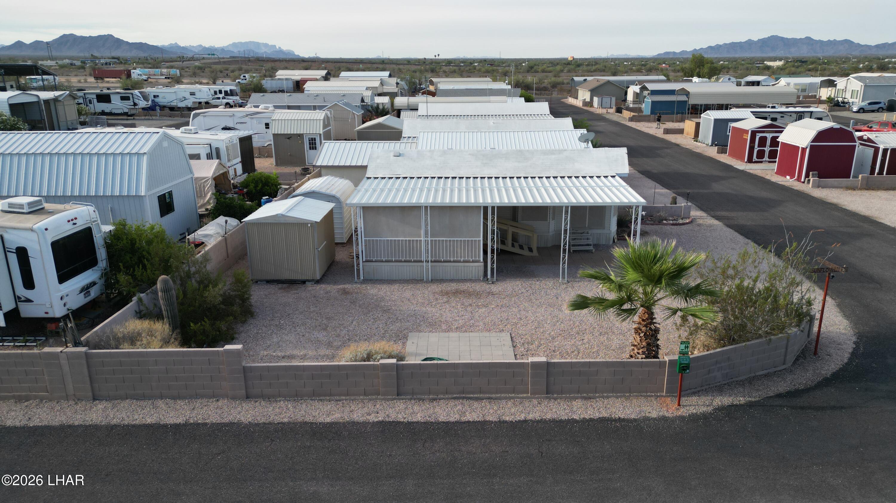 41 North Sagebrush Road Quartzsite, AZ 85346 - Photo 5 of 33 an aerial view of a house with a yard and seating