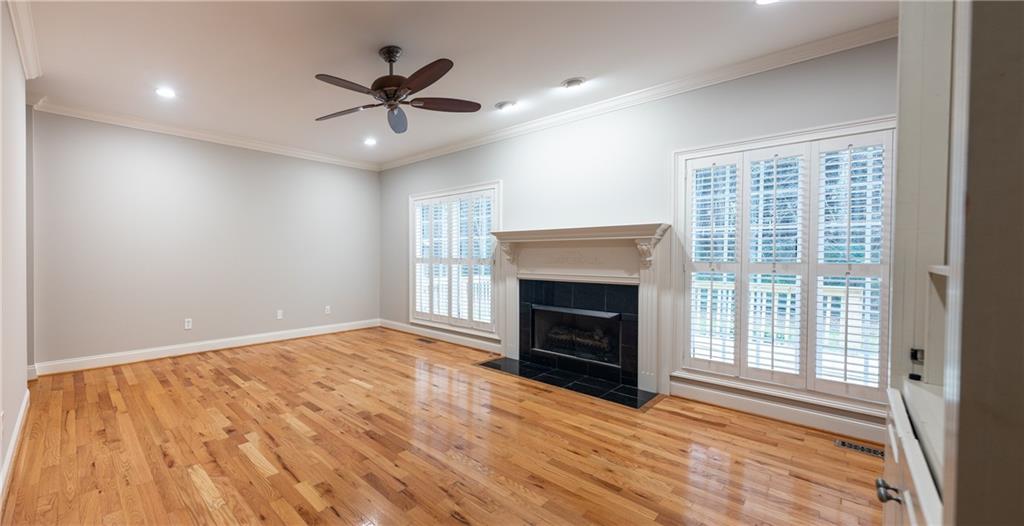122 Caverns Way Northeast Calhoun, GA 30701 - Photo 13 of 56 an empty room with windows and a fireplace