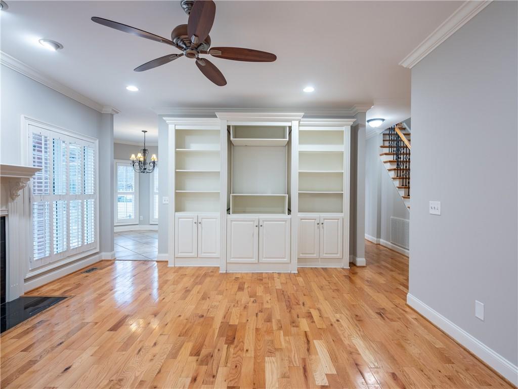 122 Caverns Way Northeast Calhoun, GA 30701 - Photo 14 of 56 a view of an empty room with wooden floor and a window