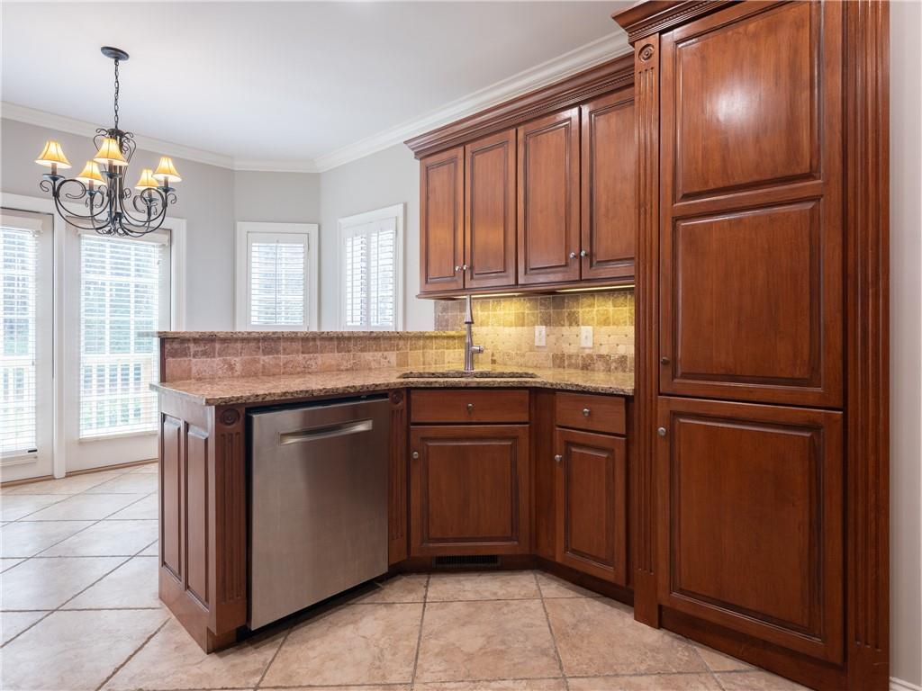 122 Caverns Way Northeast Calhoun, GA 30701 - Photo 18 of 56 a kitchen with granite countertop stainless steel appliances a refrigerator and cabinets