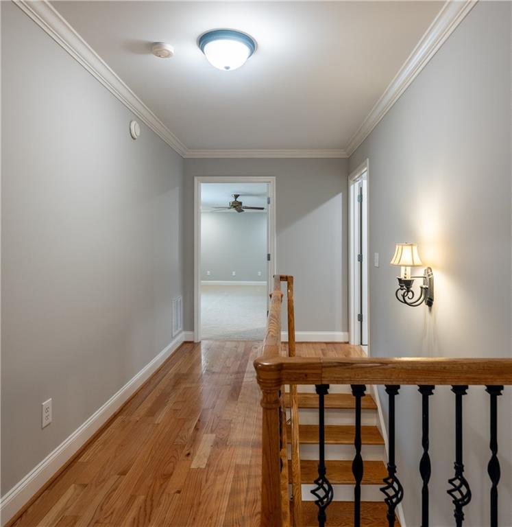 122 Caverns Way Northeast Calhoun, GA 30701 - Photo 28 of 56 a view of a hallway with wooden floor and staircase