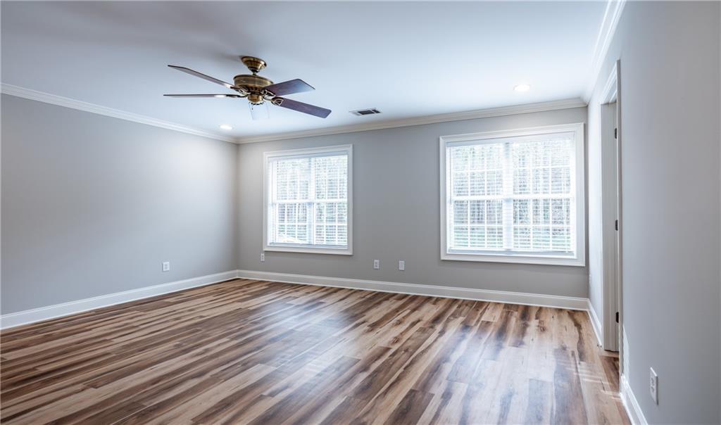122 Caverns Way Northeast Calhoun, GA 30701 - Photo 29 of 56 a view of an empty room with wooden floor and a window