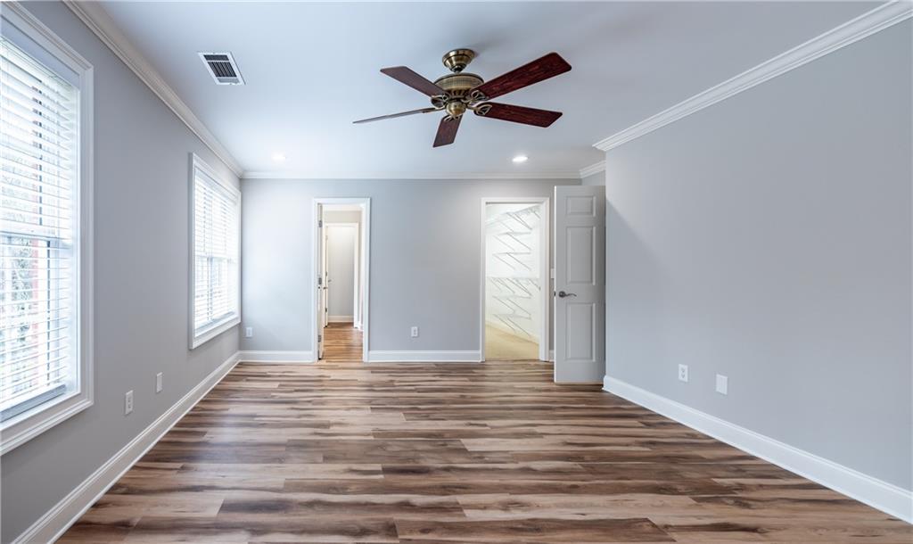 122 Caverns Way Northeast Calhoun, GA 30701 - Photo 31 of 56 a view of empty room with wooden floor and fan
