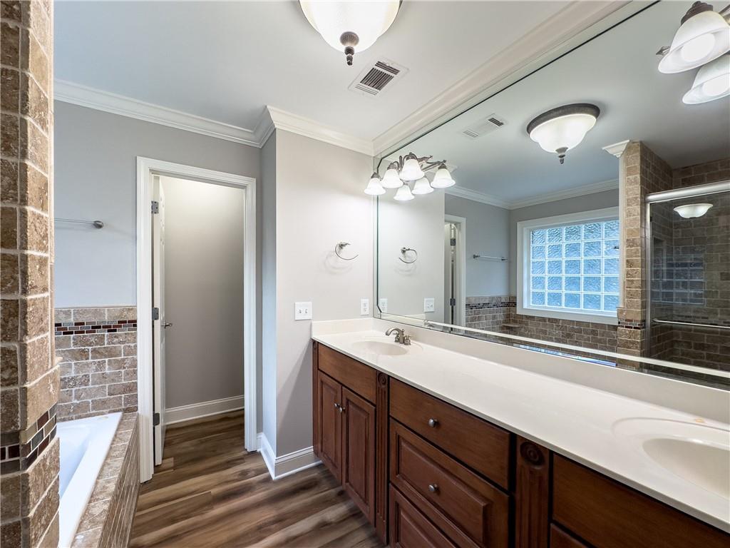 122 Caverns Way Northeast Calhoun, GA 30701 - Photo 34 of 56 a spacious bathroom with double sink and a mirror