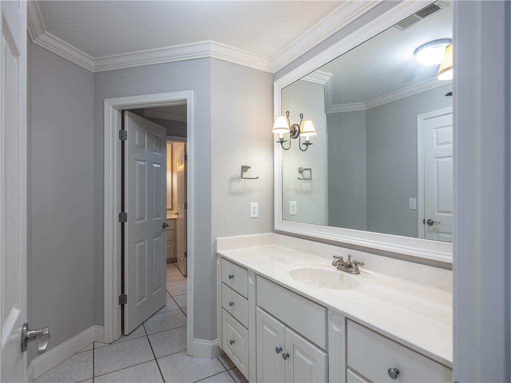 122 Caverns Way Northeast Calhoun, GA 30701 - Photo 48 of 56 a bathroom with a granite countertop sink and a mirror