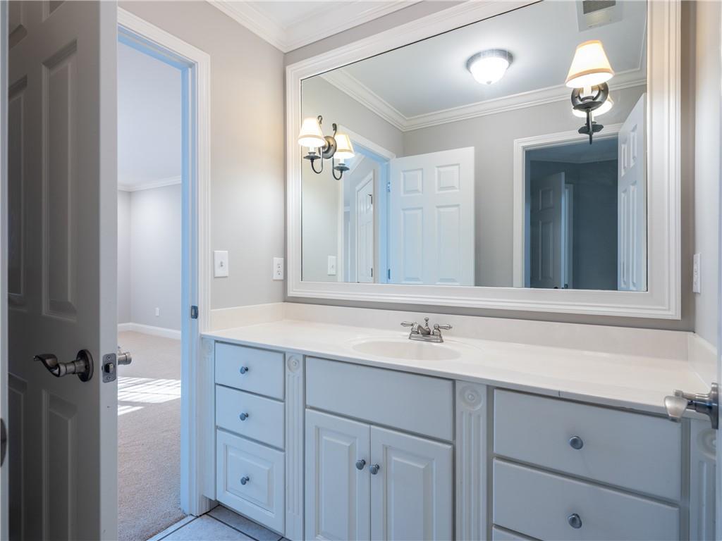 122 Caverns Way Northeast Calhoun, GA 30701 - Photo 52 of 56 a bathroom with a sink and a mirror