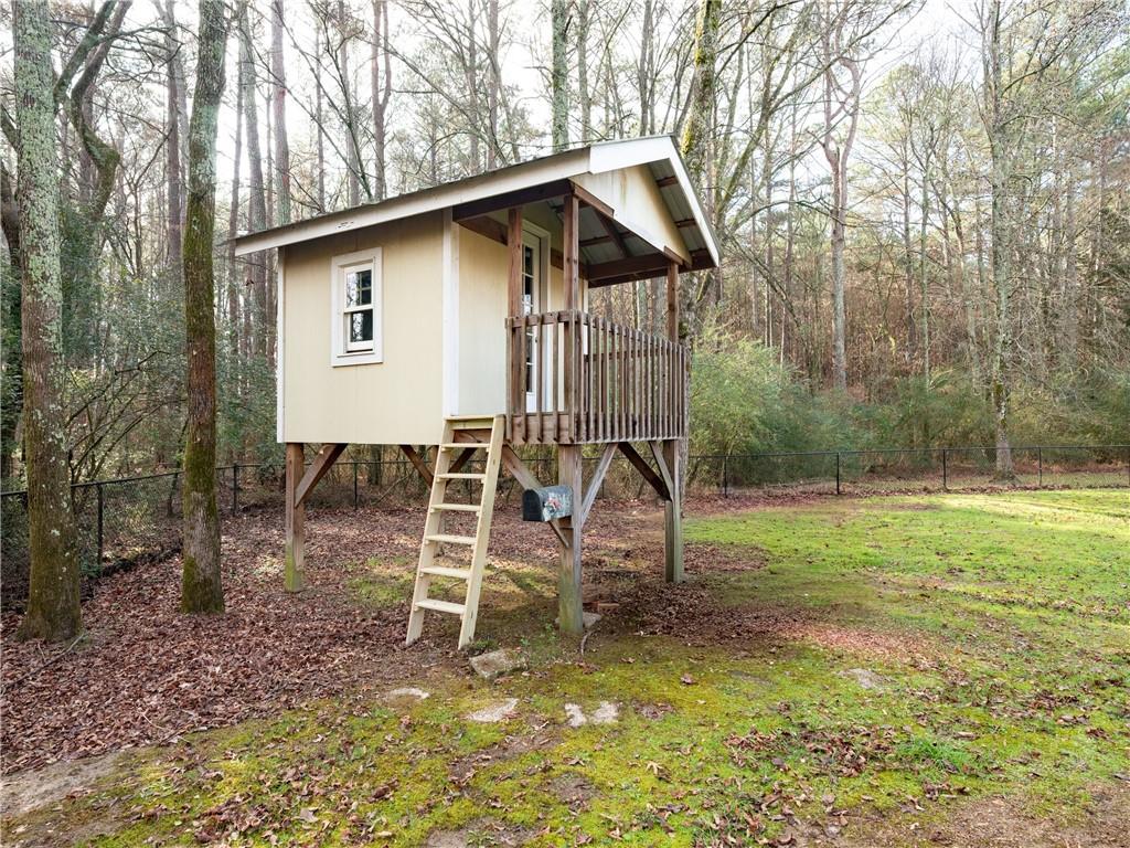 122 Caverns Way Northeast Calhoun, GA 30701 - Photo 56 of 56 a view of a house with backyard