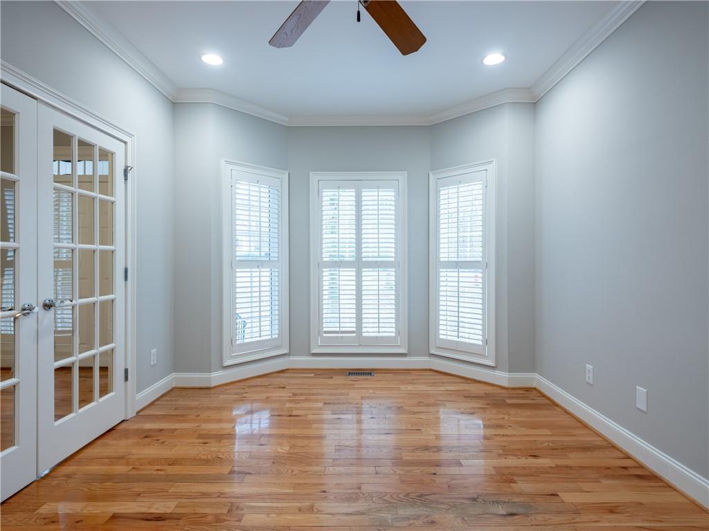 122 Caverns Way Northeast Calhoun, GA 30701 - Photo 9 of 56 wooden floor in an empty room with a window