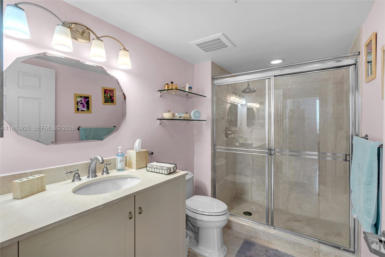 3232 Southwest 22nd Terrace, Unit 801 Miami, FL 33145 - Photo 13 of 23 a bathroom with a sink vanity mirror and toilet