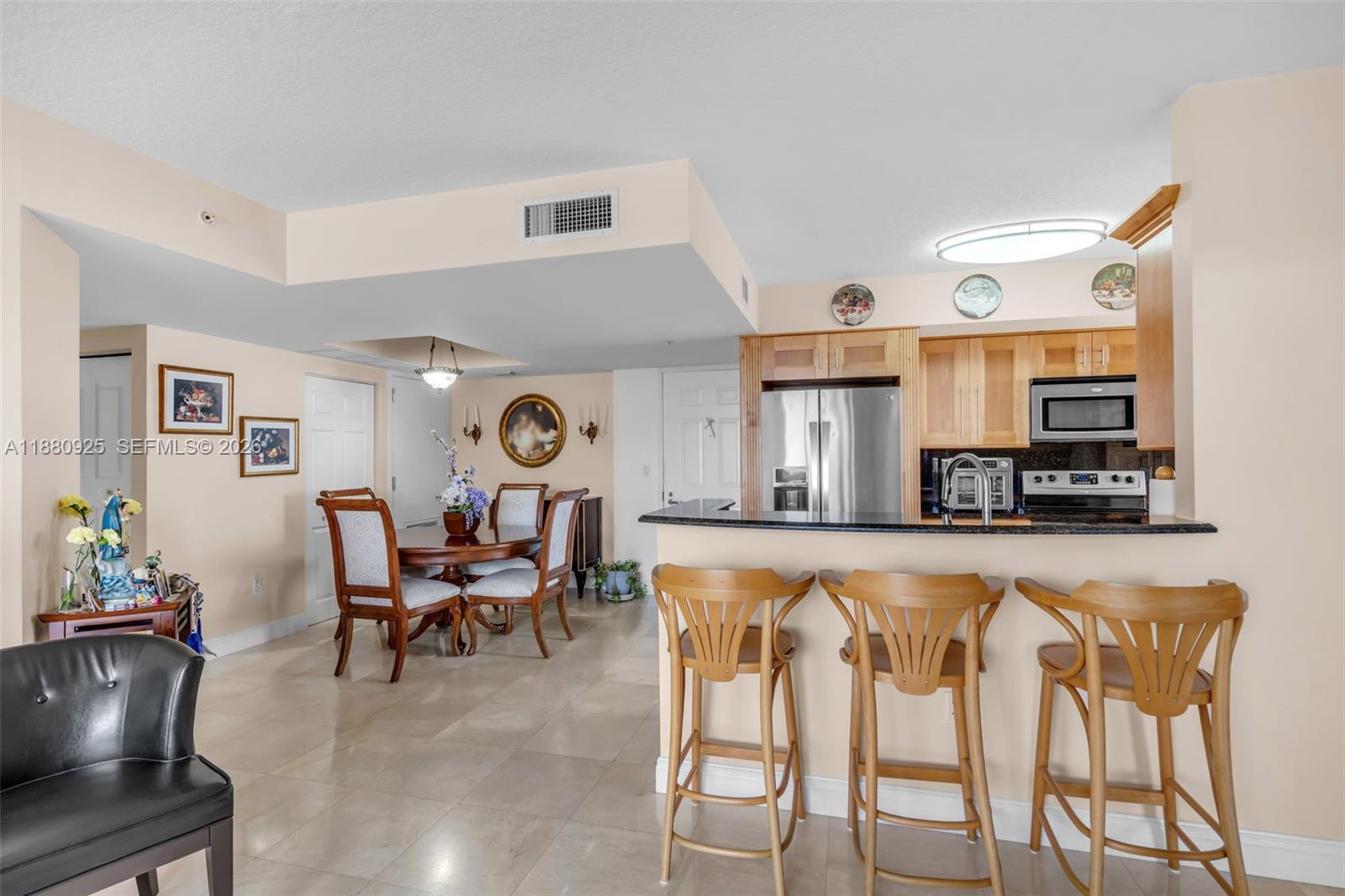 3232 Southwest 22nd Terrace, Unit 801 Miami, FL 33145 - Photo 2 of 23 a living room with furniture and a large window