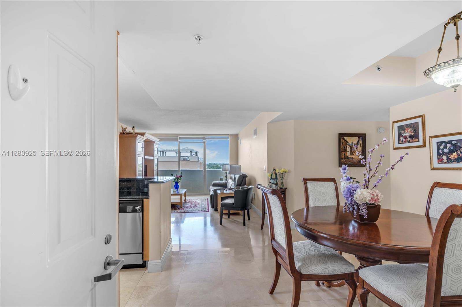 3232 Southwest 22nd Terrace, Unit 801 Miami, FL 33145 - Photo 5 of 23 a dining room with furniture and wooden floor