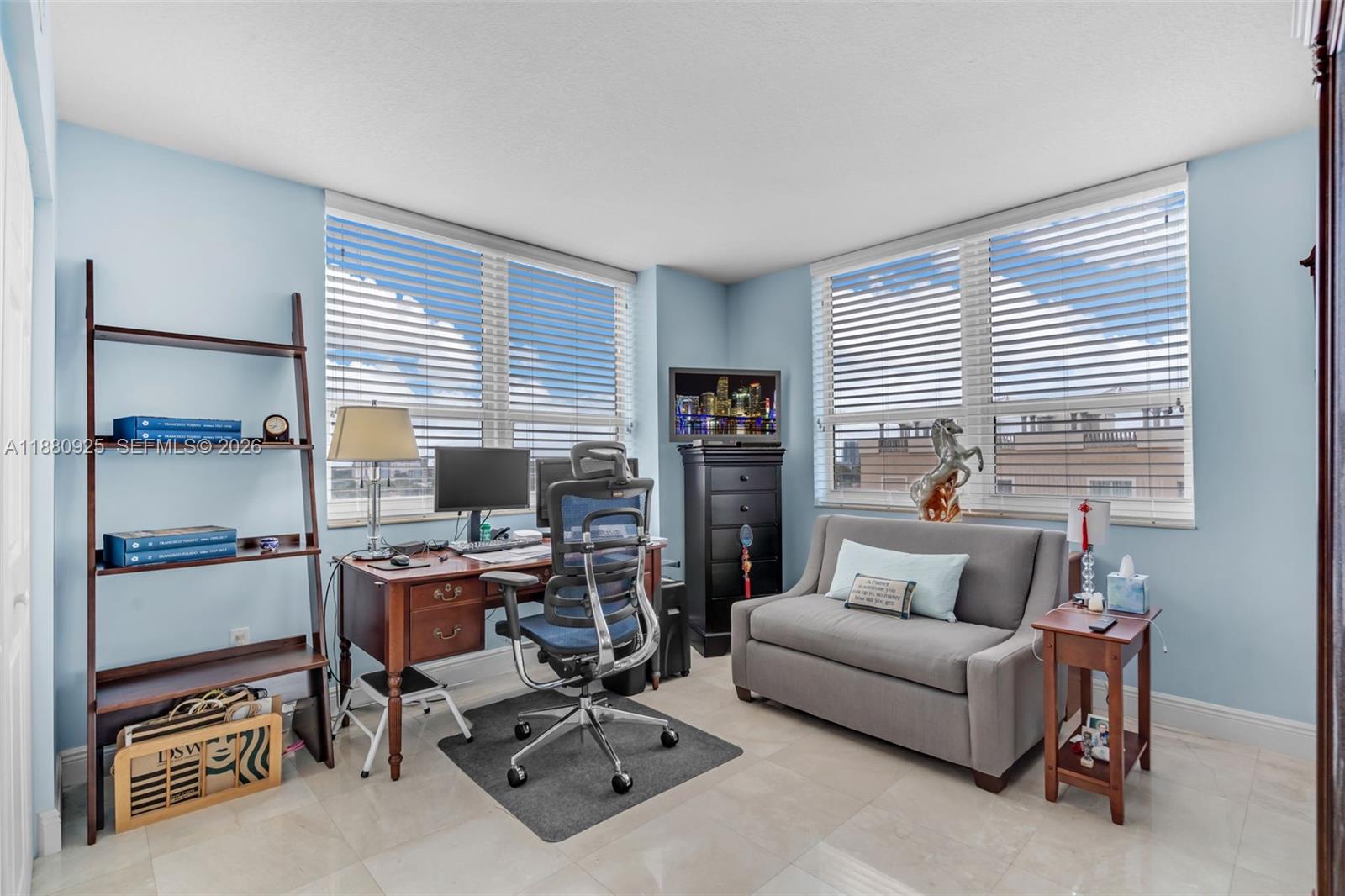 3232 Southwest 22nd Terrace, Unit 801 Miami, FL 33145 - Photo 7 of 23 a living room with furniture a window and a flat screen tv