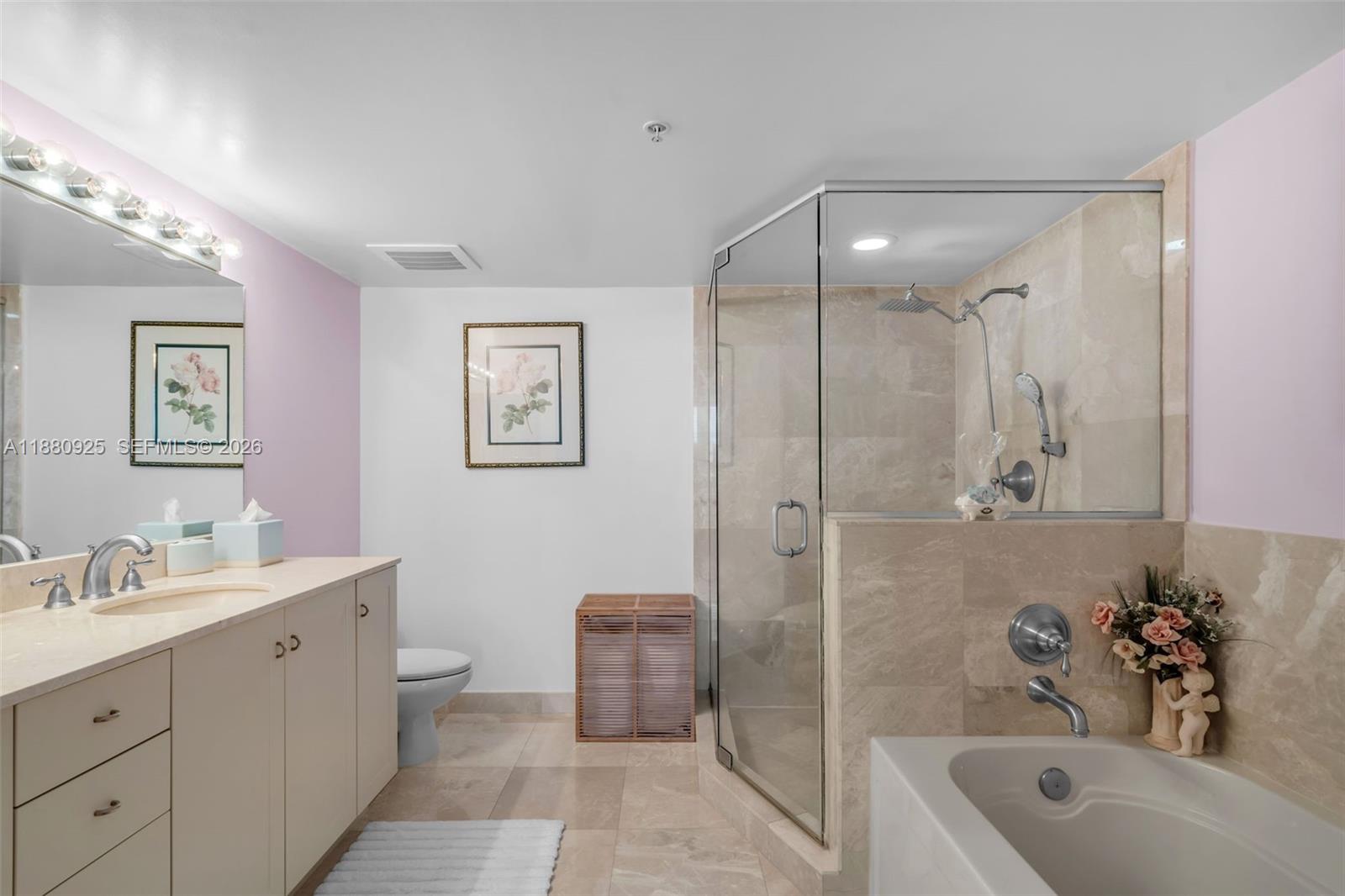 3232 Southwest 22nd Terrace, Unit 801 Miami, FL 33145 - Photo 9 of 23 a bathroom with a tub sink toilet and mirror