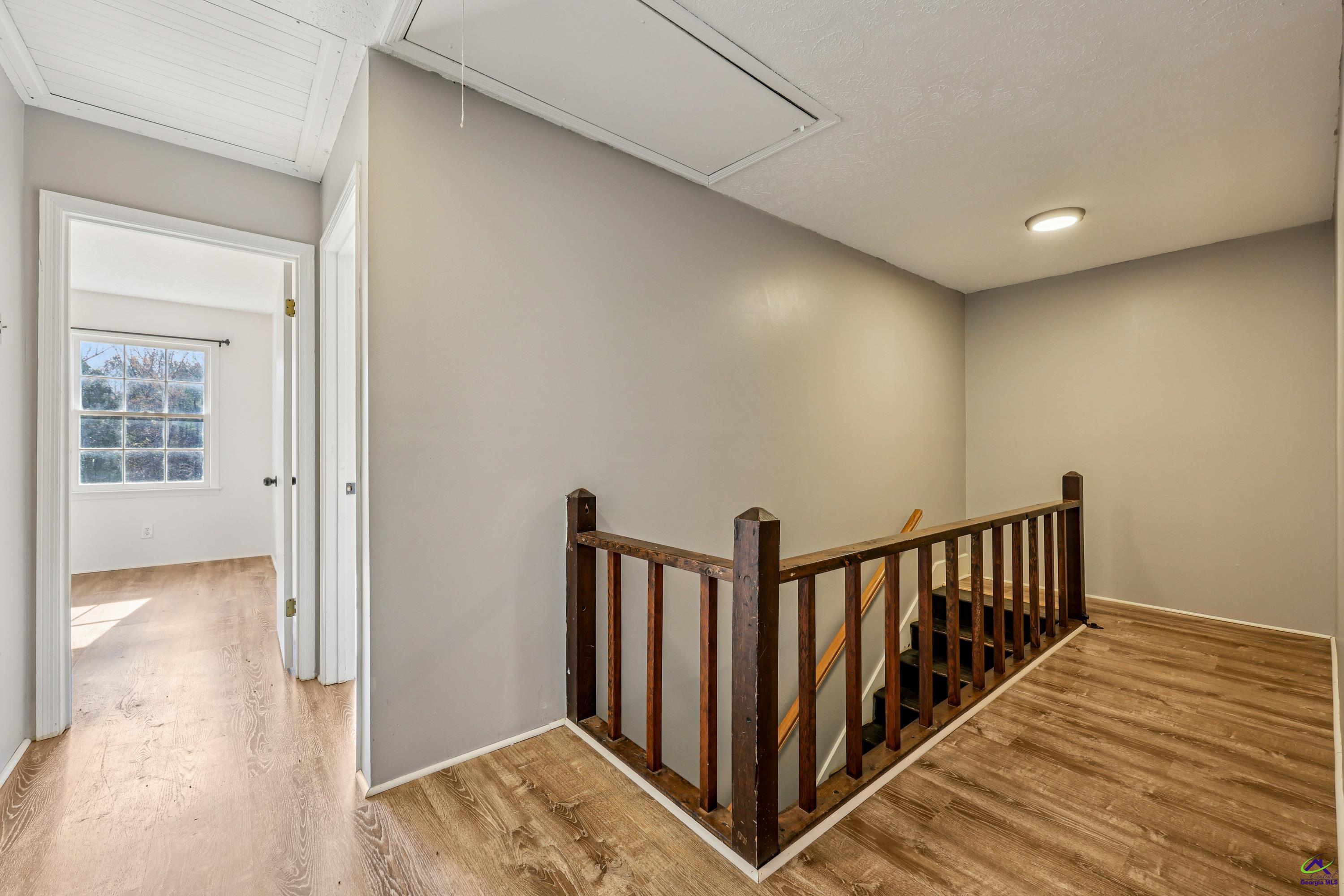 548 Greene Settlement Road Gray, GA 31032 - Photo 26 of 68 a view of hallway with wooden floor