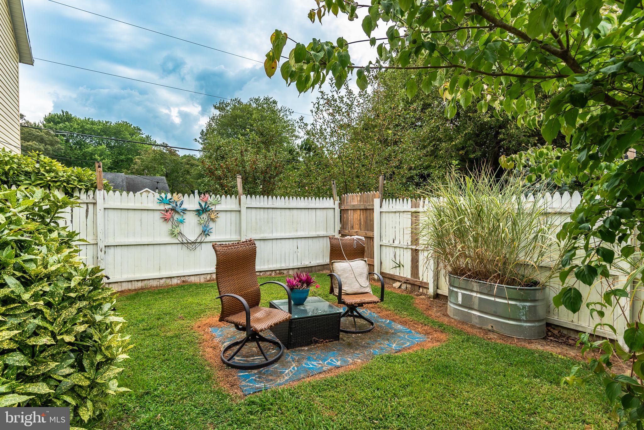 10213 Germantown Road Berlin, MD 21811 - Photo 116 of 118 a view of a backyard with couches chair and grass