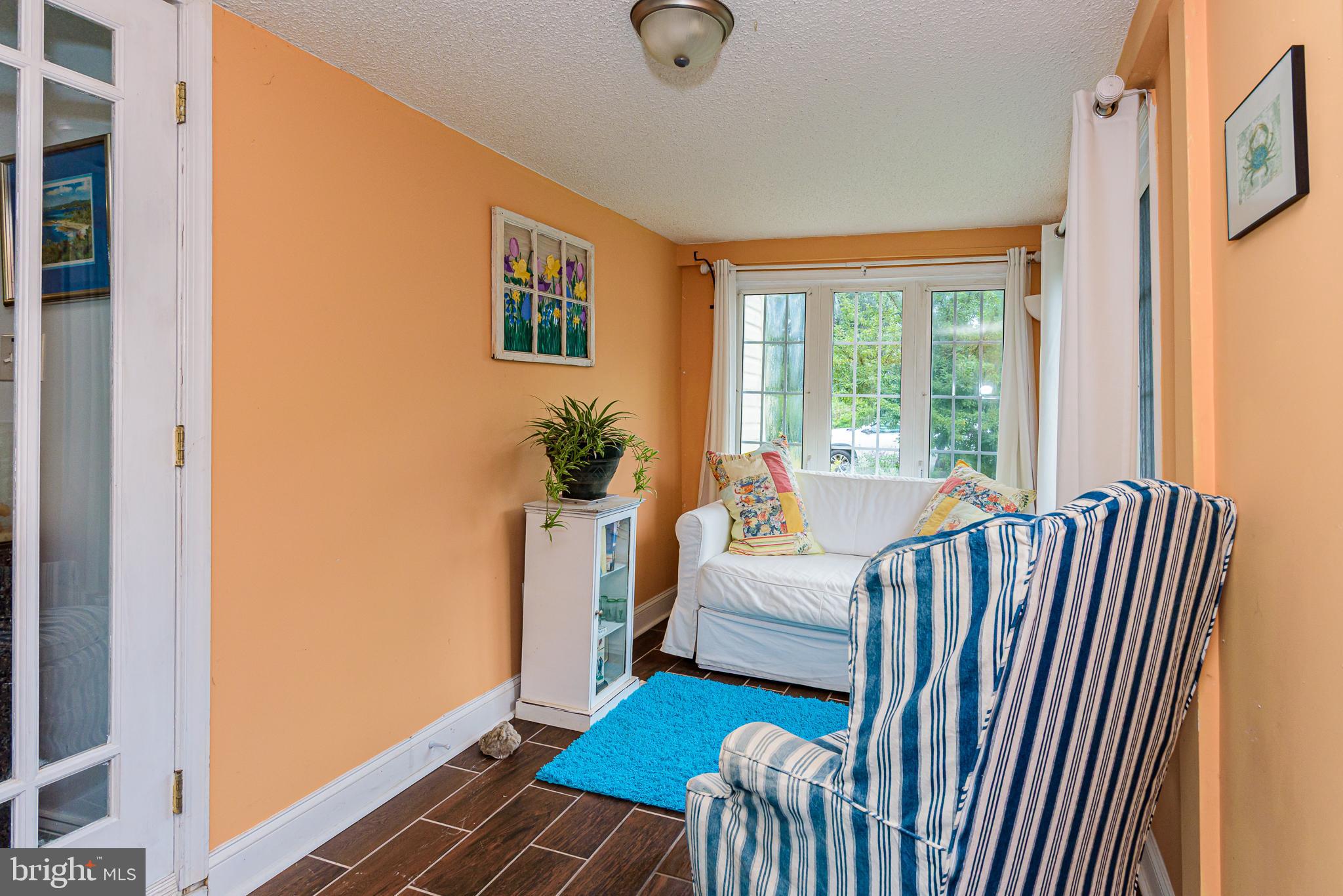 10213 Germantown Road Berlin, MD 21811 - Photo 12 of 118 a living room with furniture and a window