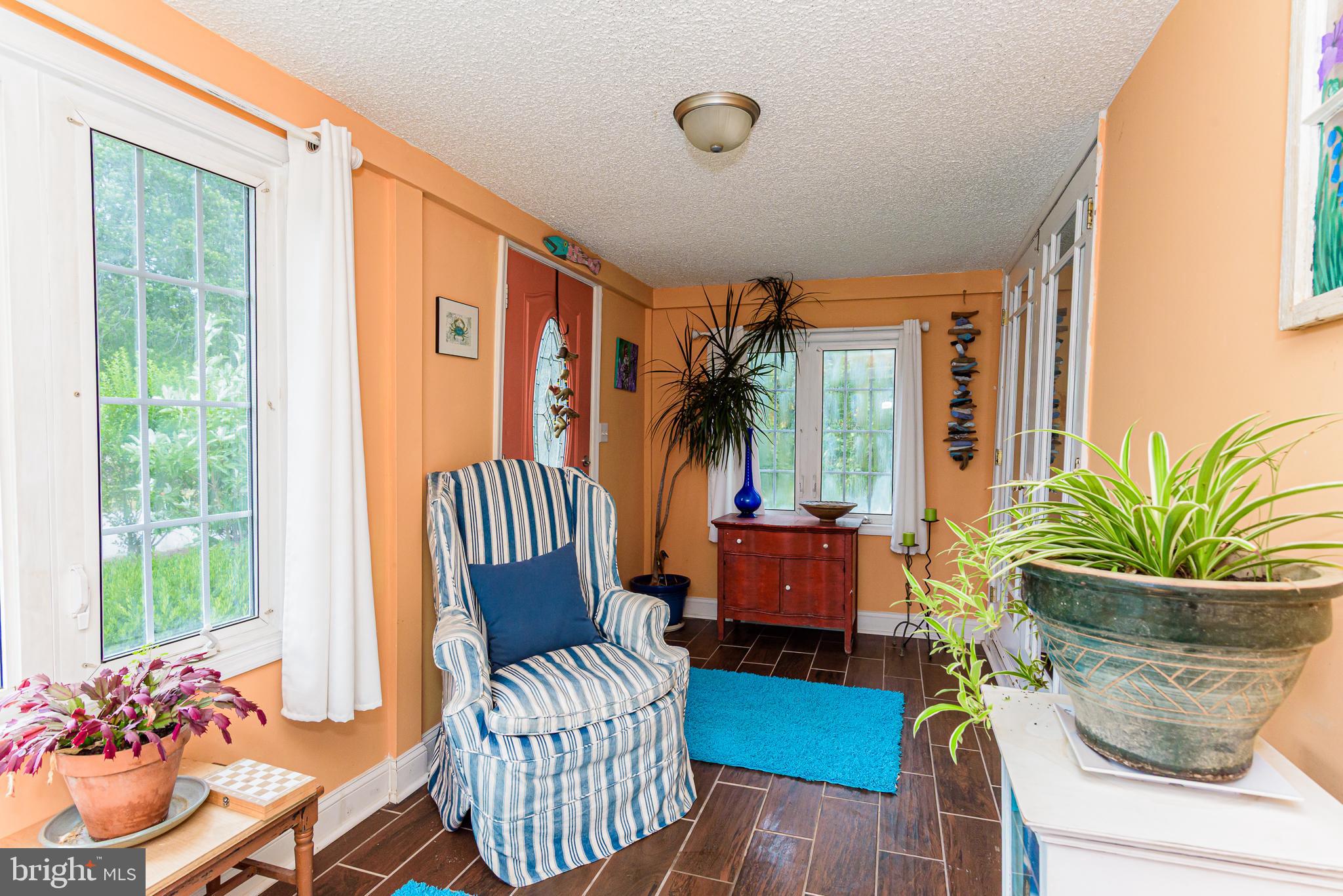10213 Germantown Road Berlin, MD 21811 - Photo 14 of 118 a living room with furniture and a large window