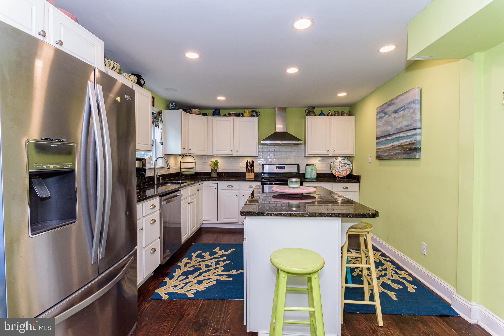 10213 Germantown Road Berlin, MD 21811 - Photo 18 of 118 a kitchen with stainless steel appliances granite countertop a refrigerator a stove and a sink