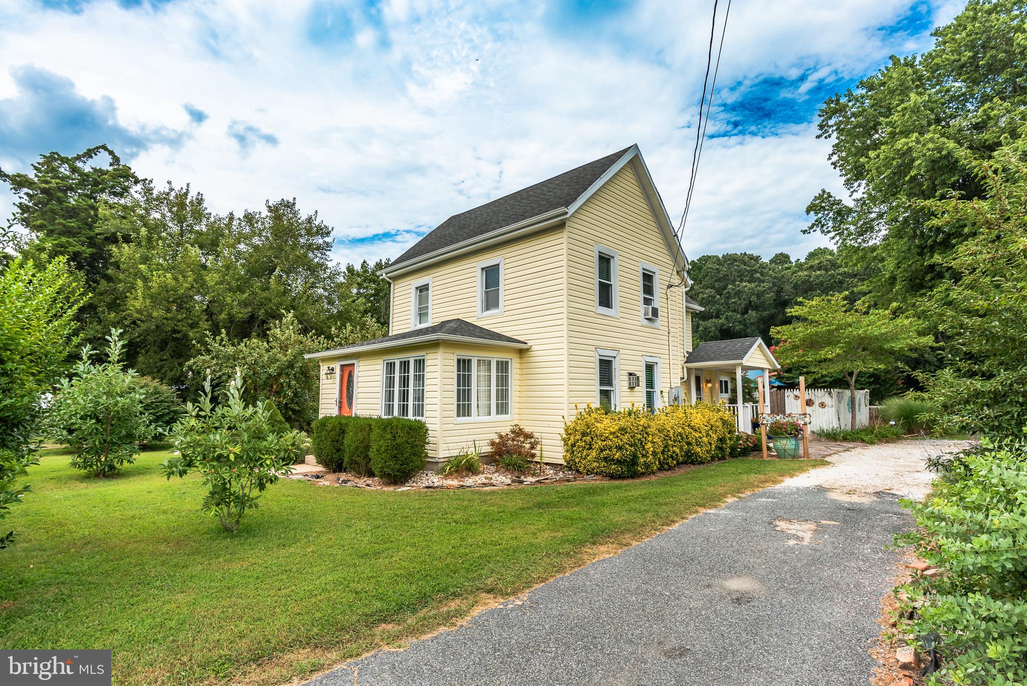 10213 Germantown Road Berlin, MD 21811 - Photo 2 of 118 a front view of a house with a garden