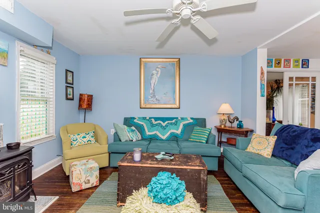 a bedroom with a bed and painting on the wall