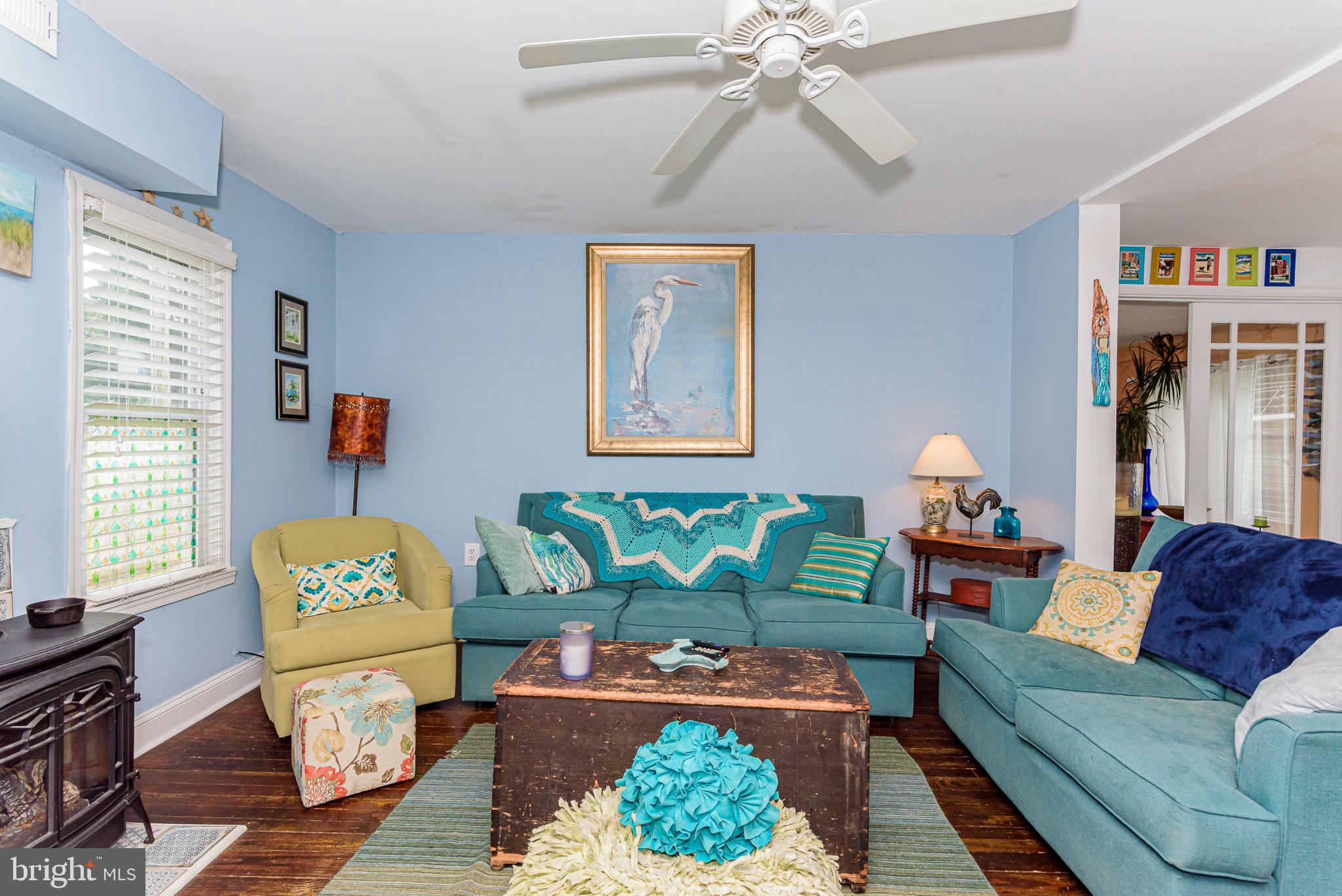10213 Germantown Road Berlin, MD 21811 - Photo 26 of 118 a living room with furniture and a wooden floor