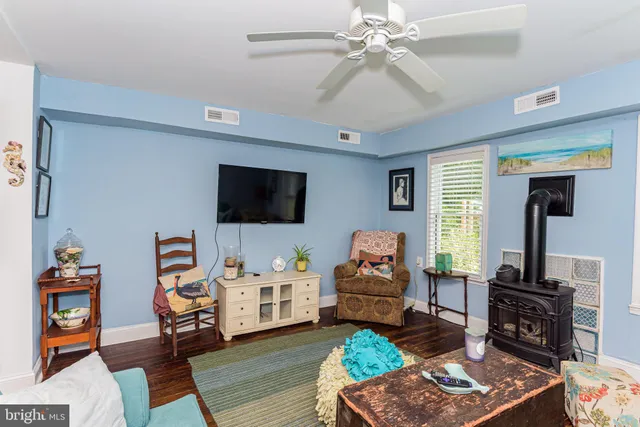 a bathroom with a toilet a sink and vanity