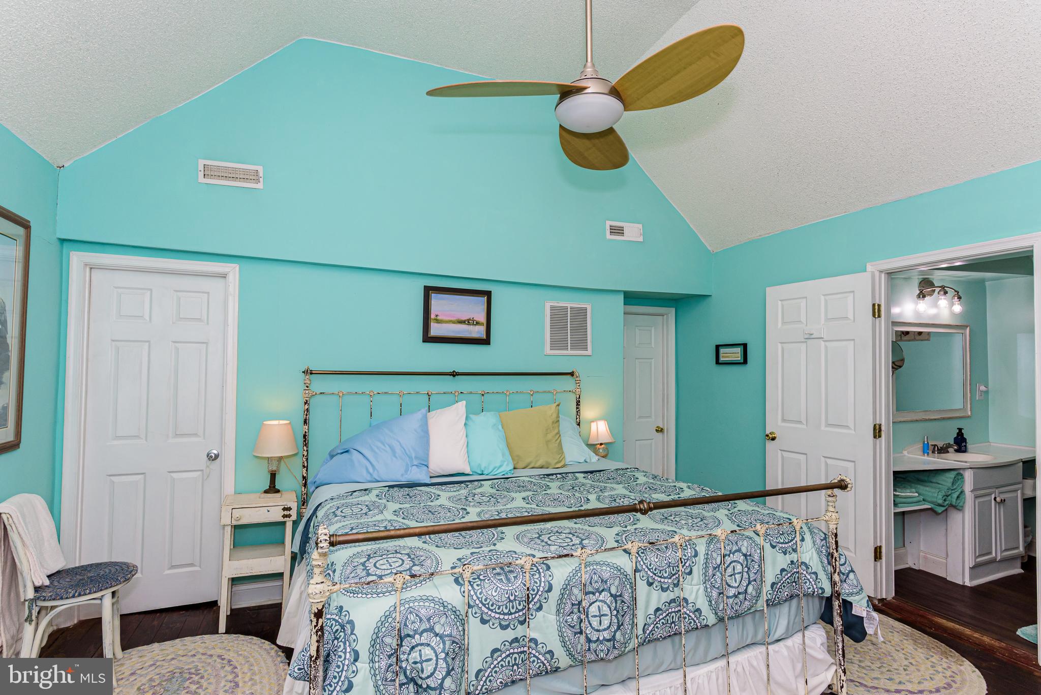 10213 Germantown Road Berlin, MD 21811 - Photo 35 of 118 a bedroom with a bed and painting on the wall