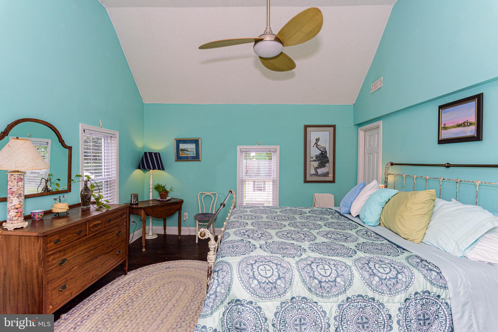 10213 Germantown Road Berlin, MD 21811 - Photo 37 of 118 a bedroom with a bed and dresser