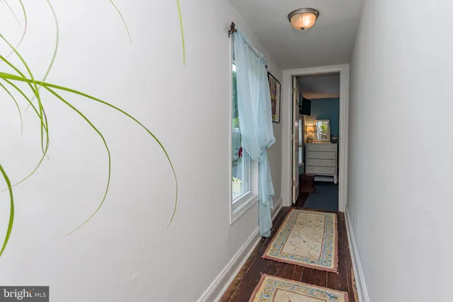 a kitchen with stainless steel appliances granite countertop a refrigerator a stove and a wooden floors