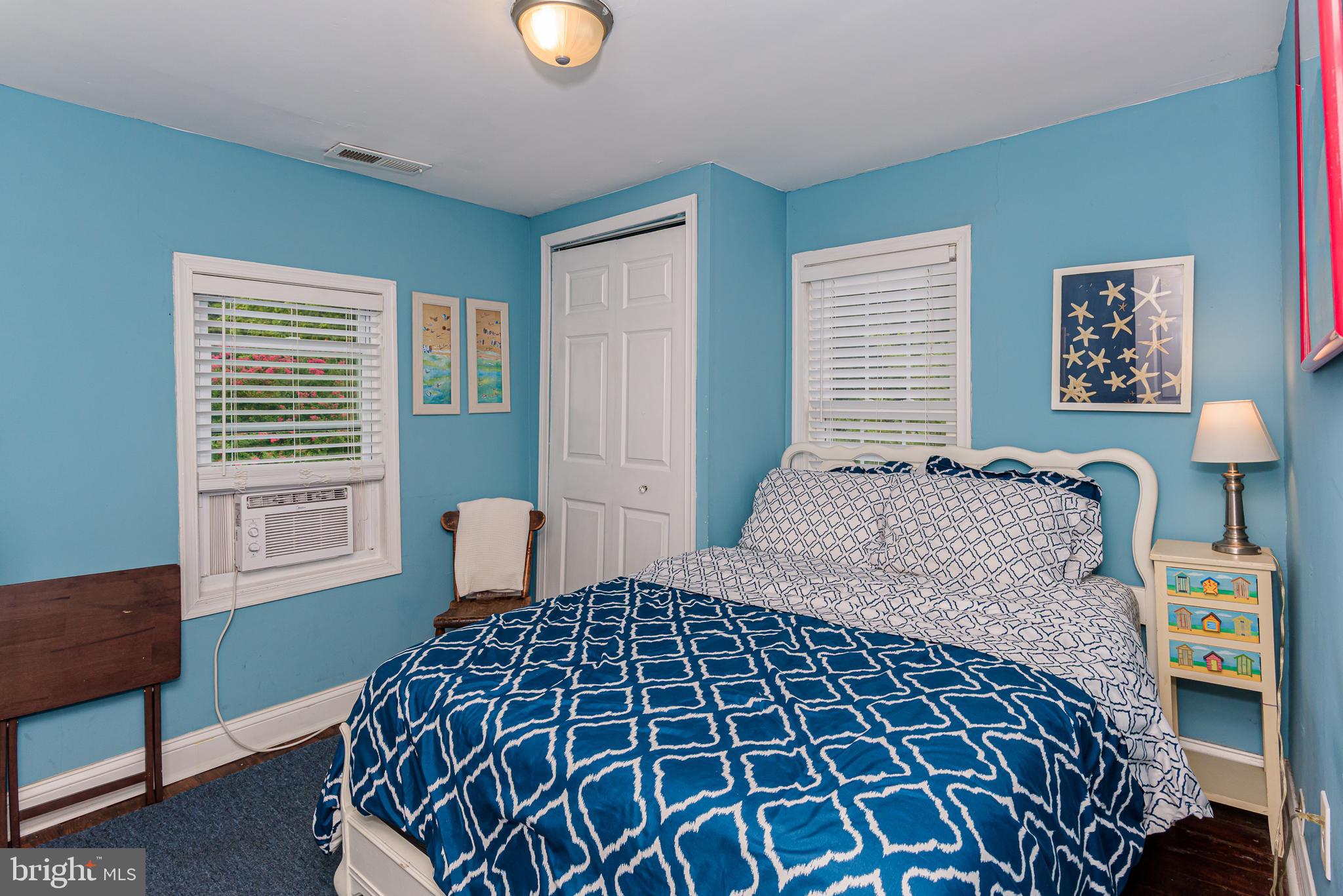 10213 Germantown Road Berlin, MD 21811 - Photo 46 of 118 a bedroom with a large bed and a window