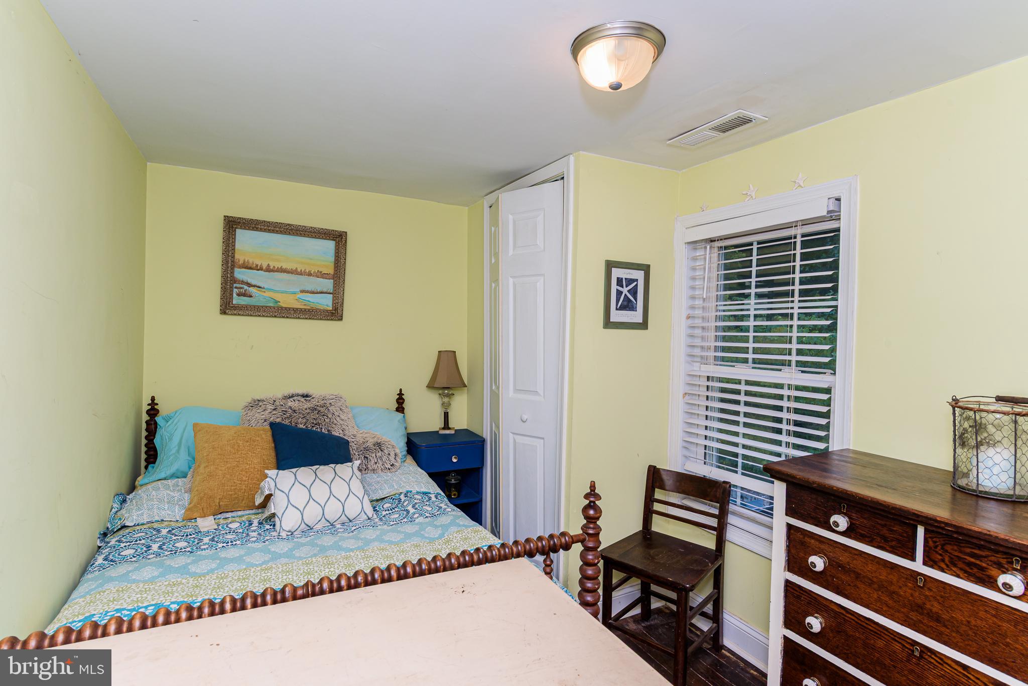 10213 Germantown Road Berlin, MD 21811 - Photo 54 of 118 a bedroom with a bed and a window