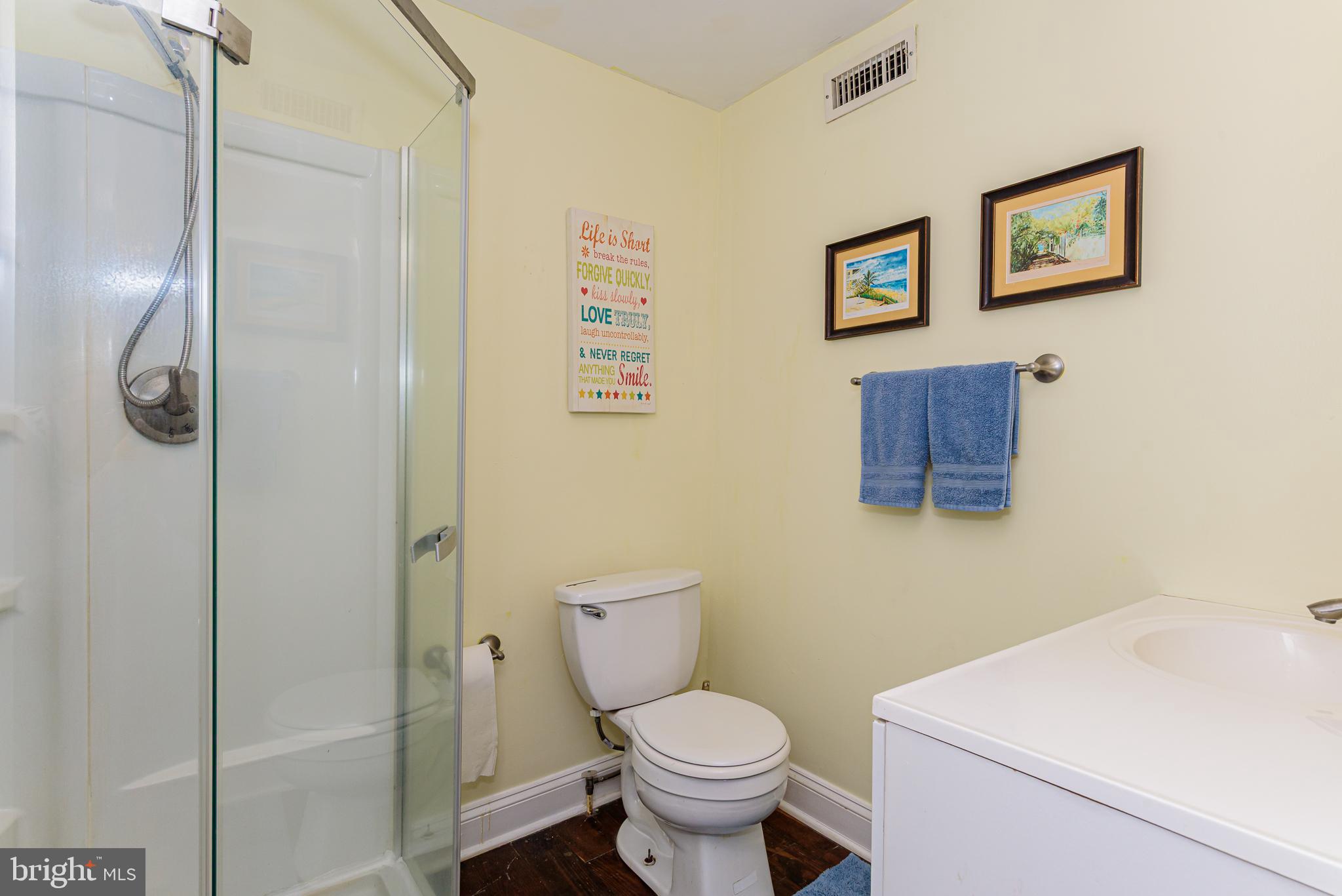 10213 Germantown Road Berlin, MD 21811 - Photo 58 of 118 a white toilet sitting next to a bathroom sink