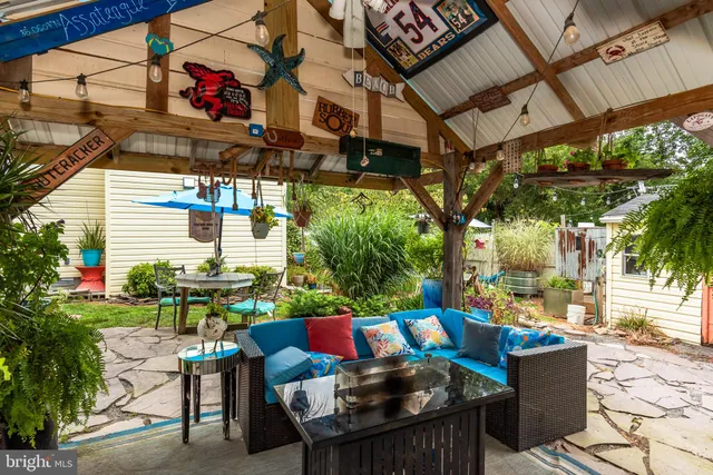 a kitchen with stainless steel appliances granite countertop a refrigerator a stove and a sink