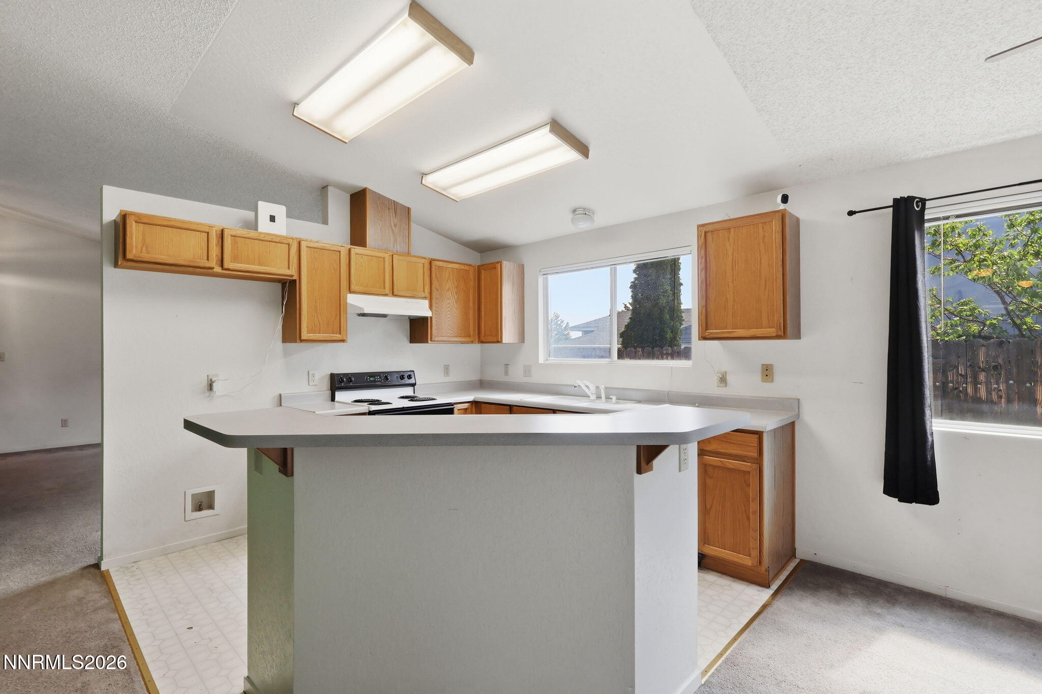 6840 Viscaya Court Reno, NV 89523 - Photo 15 of 25 a kitchen with stainless steel appliances granite countertop a sink and a stove