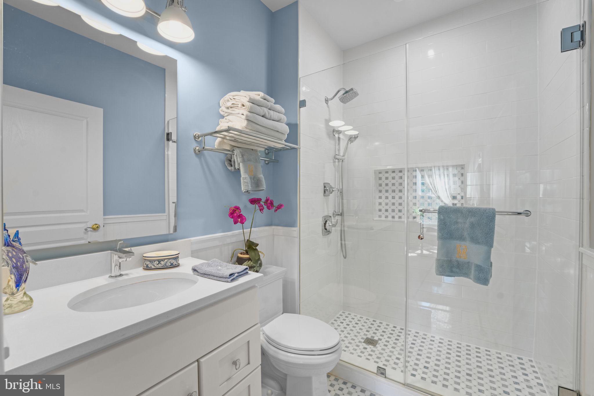 11431 Woolington Road Great Falls, VA 22066 - Photo 7 of 49 a bathroom with a sink toilet and shower