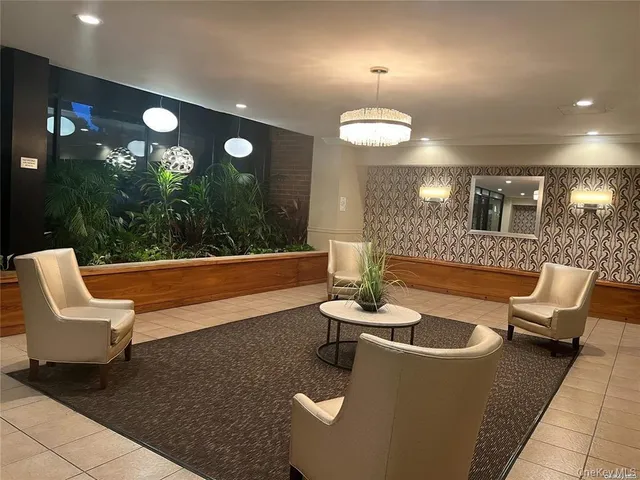 a view of a livingroom with furniture and chandelier