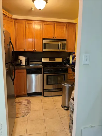 a kitchen with a stove and a microwave