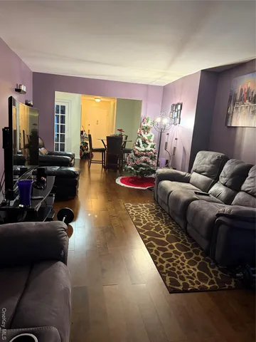 a living room with furniture fireplace and flat screen tv