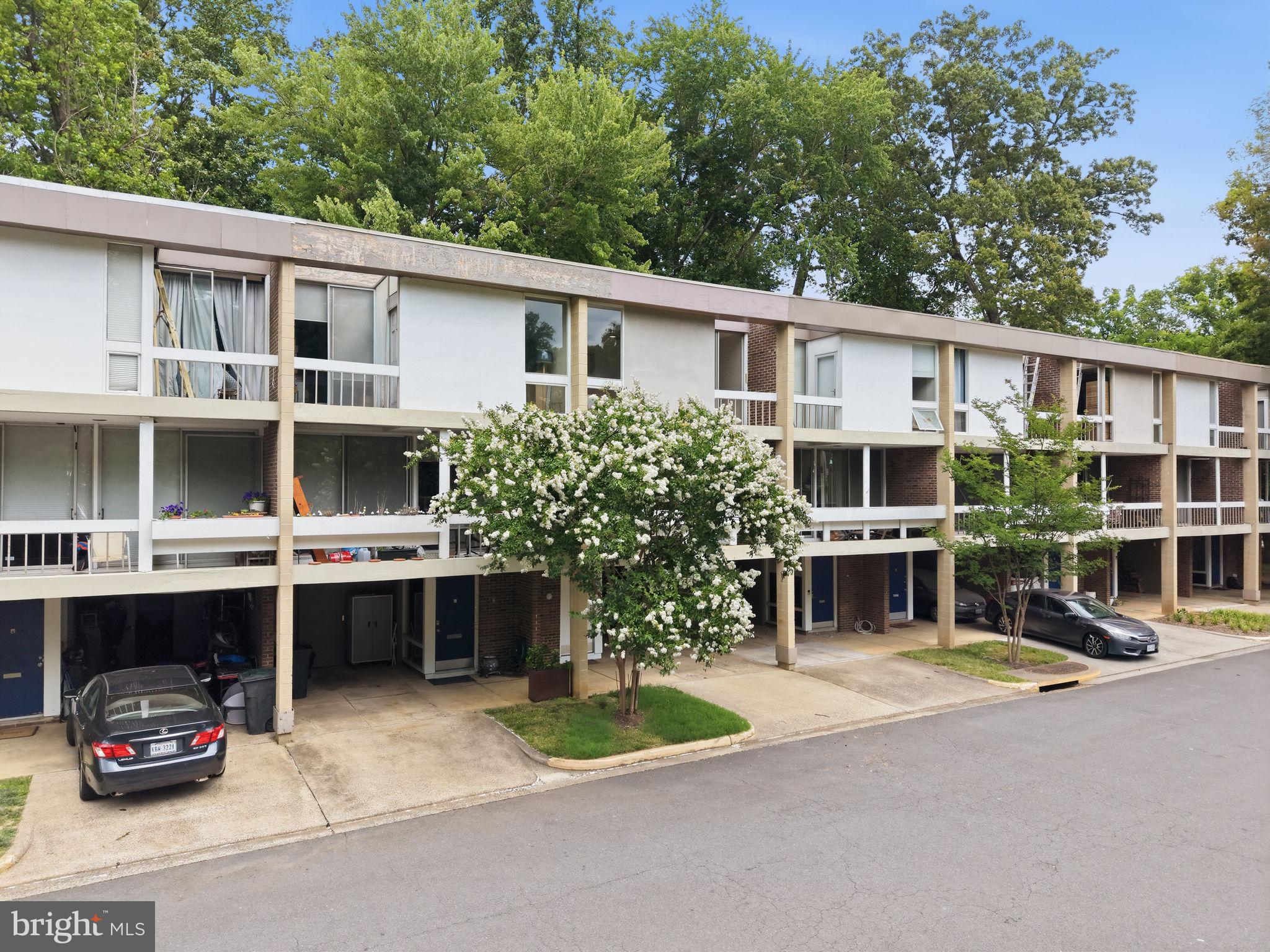11510 Maple Ridge Road Reston, VA 20190 - Photo 40 of 43 a view of house with outdoor seating and car parked