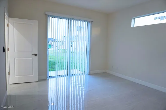 a view of a livingroom with a floor to ceiling window