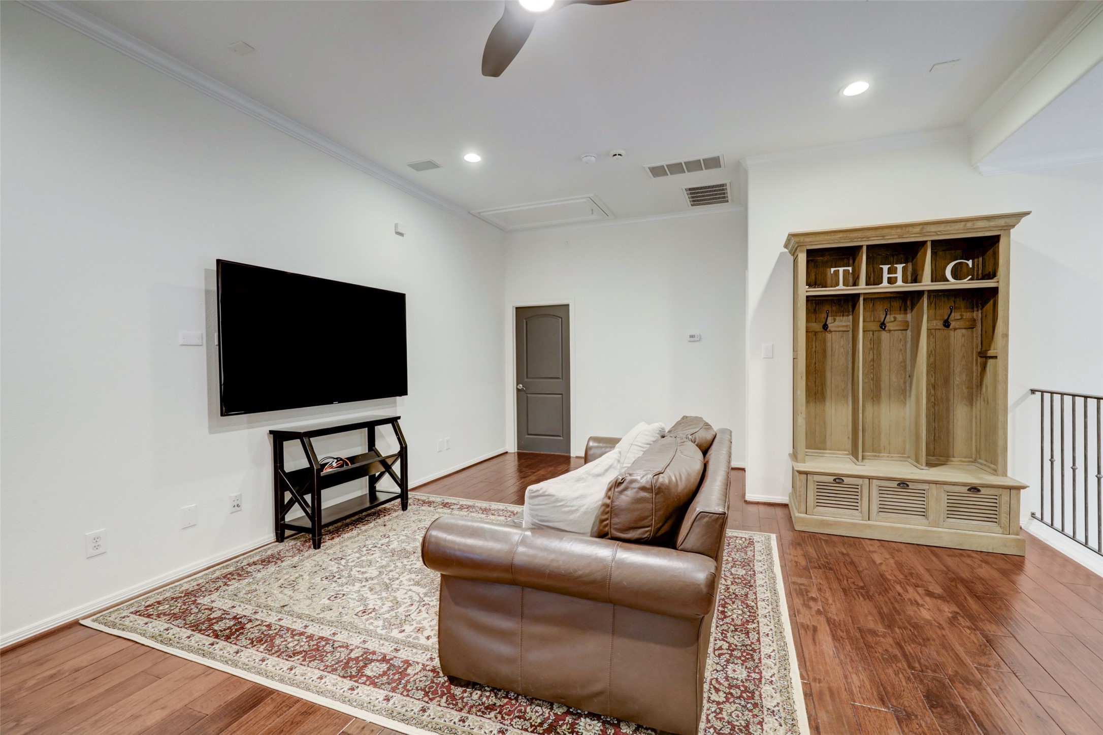 4004 Childress Street Houston, TX 77005 - Photo 18 of 35 a living room with furniture and a flat screen tv